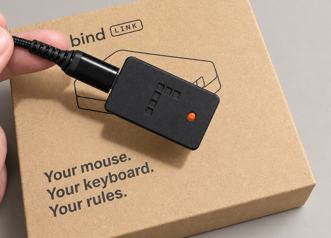 Photo of Rebind Link with the braided cable plugged in and its orange light on, held over its box